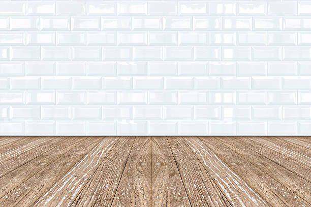 istock White Ceramic brick tile wall and wooden floor 496991447