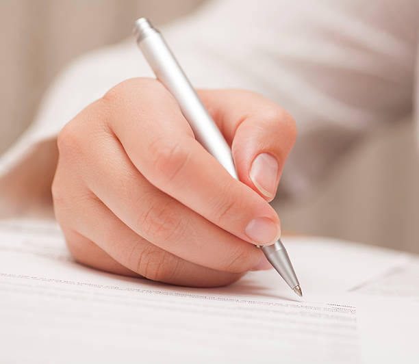 istock Businesswoman signing contract 496992417