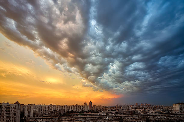 istock Background of a sunset storm clouds over cityscape 496992969