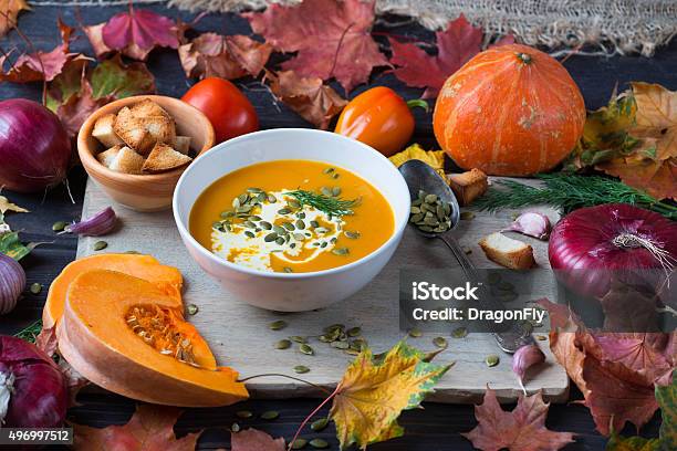 Pumpkin Soup On A Wooden Table Stock Photo - Download Image Now - 2015, Autumn, Bowl