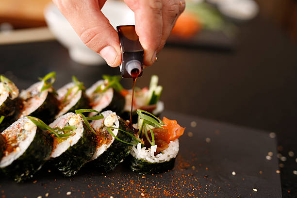istock Sushi master preparing sushi in Japanese restaurant 496998488