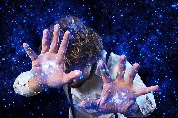Aspiring sorcerer sorcerer's apprentice who works magic with his hands magic show stock pictures, royalty-free photos & images