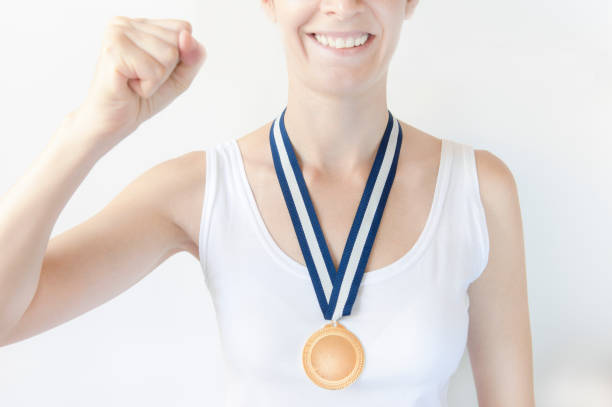 istock woman with gold medal 496999408