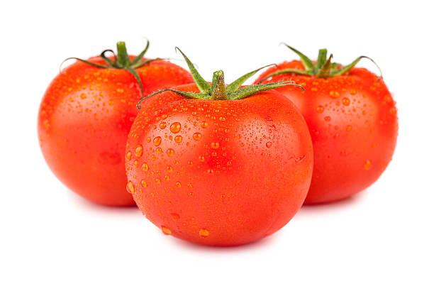 istock Three ripe red tomatoes with water drops 496999646