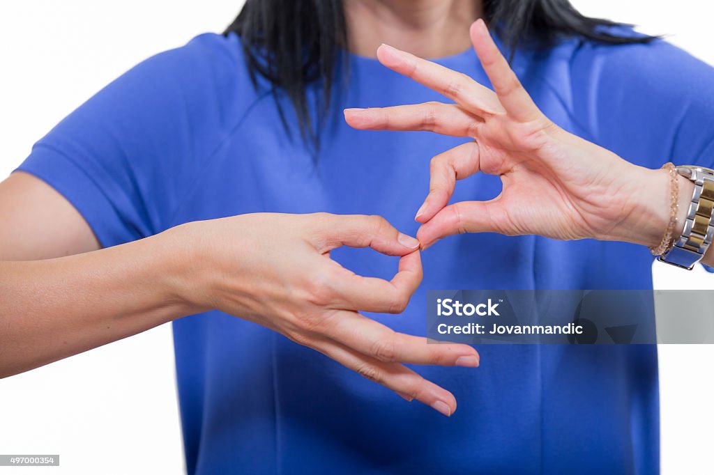Deaf woman using sign language Deaf woman using sign language, close up, isolated on white Sign Language Stock Photo