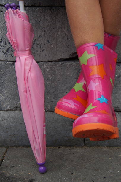 istock Cute girl boots and umbrella - autumn 497001502