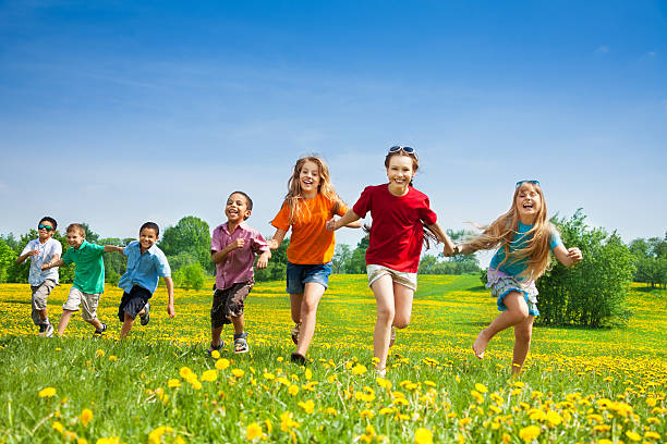istock Kids running in the field 497001777