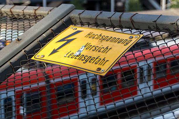 Electrical hazard sign placed on a metal fence.