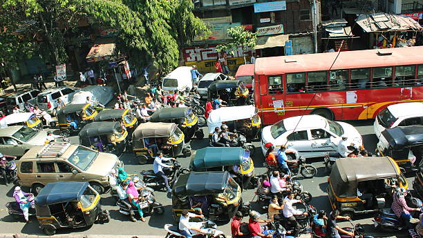 City traffic in India Traffic condition on a busy road in Pune, India. mumbai stock pictures, royalty-free photos & images