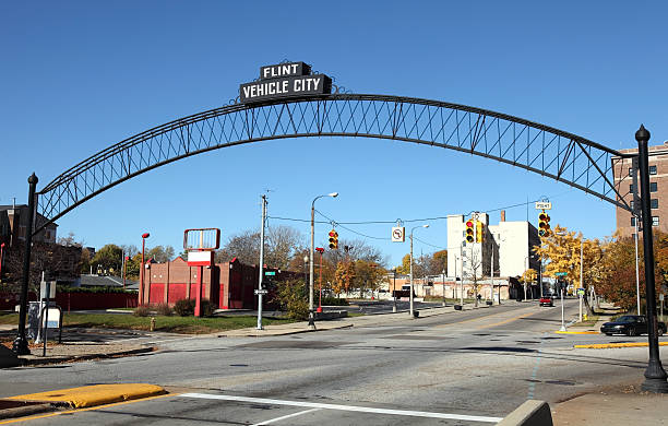 Flint Michigan Flint Vehicle City sign entering downtown  flint michigan stock pictures, royalty-free photos & images