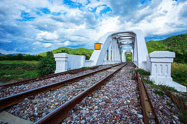 Railway Bridge over the river at cloudy stock photo