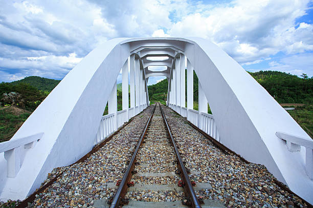 Railway Bridge over the river at cloudy stock photo