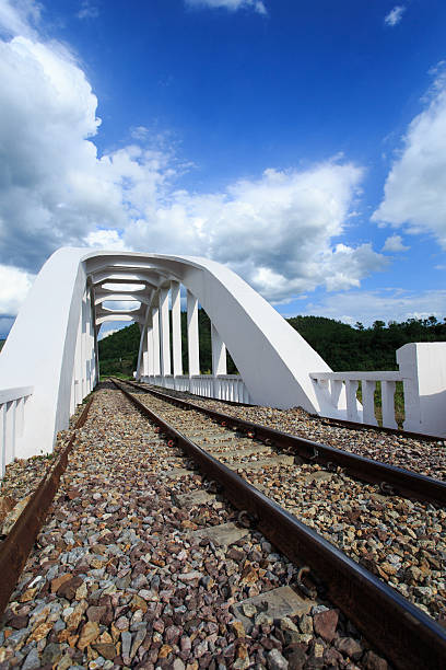 Railway Bridge over the river at cloudy stock photo