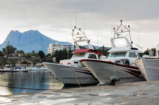 Fishing port  below the mountain at sunset