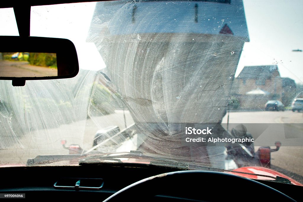 Classic mini A rare classic Italian built Innocenti Mini Cooper 1300 export, viewed through the dirty windscreen, being towed onto a trailer before being taken away and rebuilt. 2015 Stock Photo