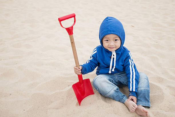 Cute Asian baby on the beach