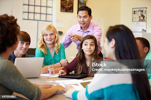 High School Students With Teacher In Class Using Laptops Stock Photo - Download Image Now