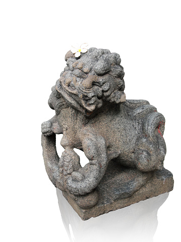 Stone lion sculpture and Plumeria