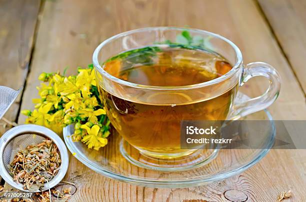 Herbal Tea From Tutsan In Strainer With Cup Stock Photo - Download Image Now - Alternative Therapy, Blossom, Clamp