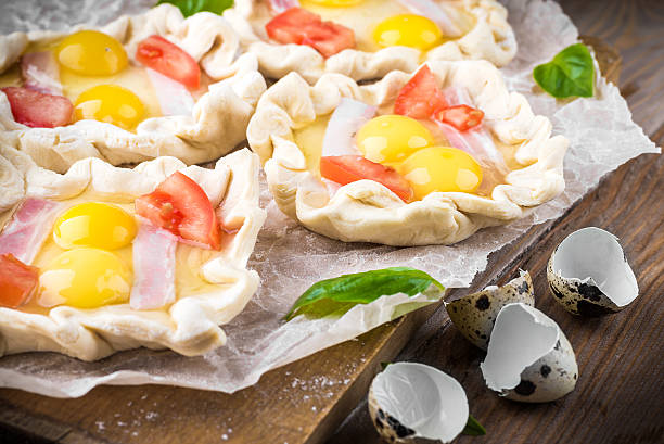istock Pie of quail eggs with tomato 497006067