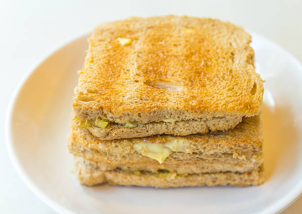 The kaya toasts on the white dish and table in Singapore