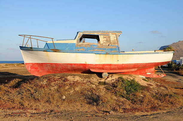 istock old fishermen boat abandoned on shore 497006959