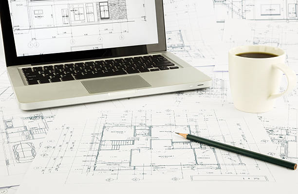 istock House blueprints and floor plan with laptop 497007273