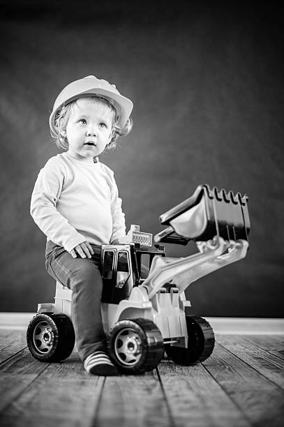 Little Girl Playing with Toy Truck - Black and White stock photo
