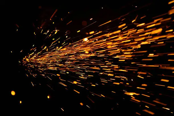 Photo of Glowing Flow of Sparks in the Dark