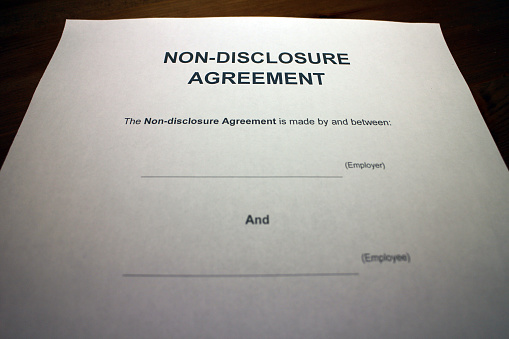 A non-disclosure agreement (NDA), also known as a confidentiality agreement (CA), confidential disclosure agreement (CDA), proprietary information agreement (PIA), or secrecy agreement (SA), is a legal contract between at least two parties that outlines confidential material, knowledge, or information that the parties wish to share with one another for certain purposes, but wish to restrict access to or by third parties. It is a contract through which the parties agree not to disclose information covered by the agreement. An NDA creates a confidential relationship between the parties to protect any type of confidential and proprietary information or trade secrets. As such, an NDA protects non-public business information.