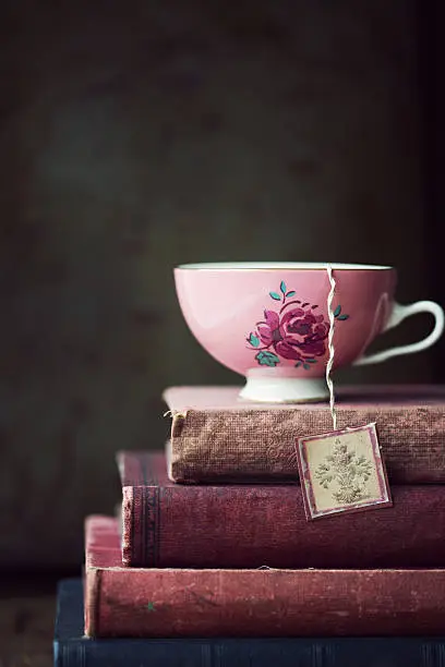 Photo of Vintage teacup on stack of old books