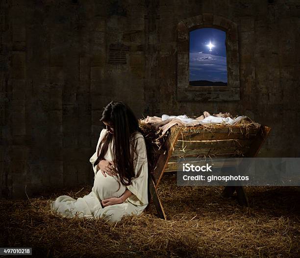 Pregnant Mary Leaning On Manger Stock Photo - Download Image Now - Virgin Mary, Nativity Scene, Christmas