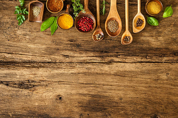 istock Colorful spices on wooden table 497012034