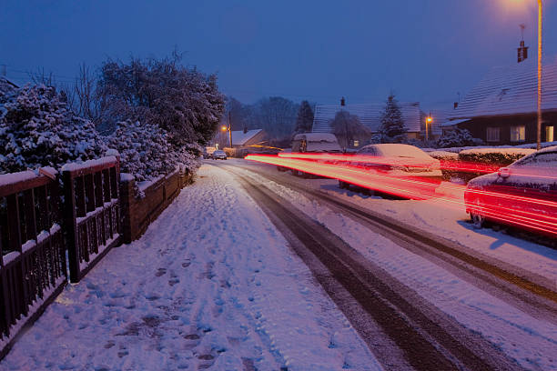 istock car lights streaming by on a snowy evening 497015515