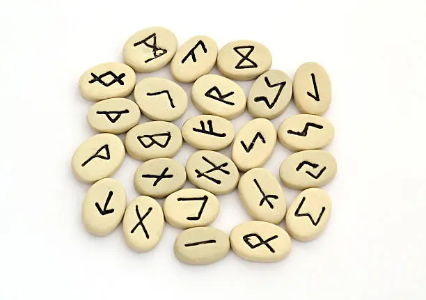 fortune telling of the nordic runes on white background