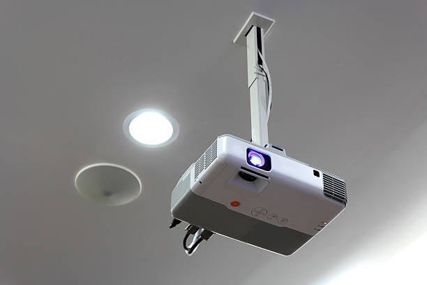 Projector hang on ceiling stock photo