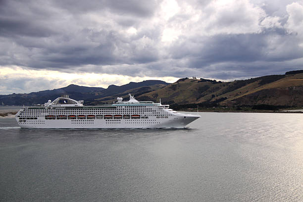 Dunedin, New Zealand, March 25, 2013 - The cruise ship Dawn Princess sails through the mouth of the Otago Harbour as it heads back into the Pacific Ocean after a day's stopover at Dunedin, on the east coast of New Zealand's South Island 