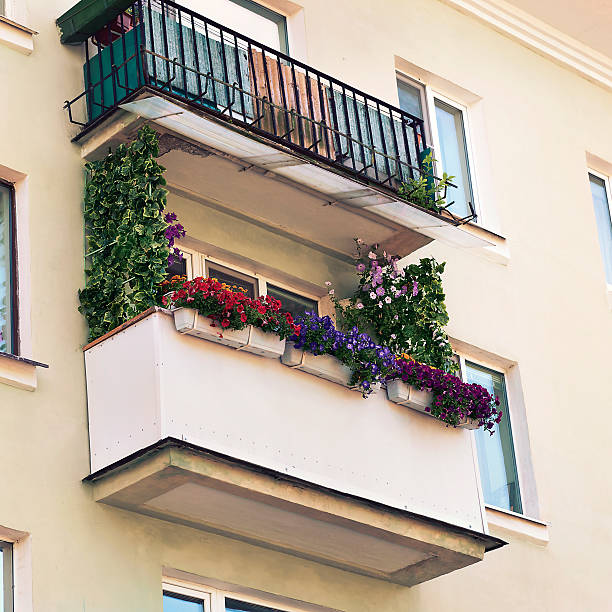 istock balcony with colorful flowers in pots 497021438