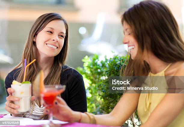 Two Girls Having An Aperitif Outdoor Stock Photo - Download Image Now - Adult, Adults Only, Alcohol - Drink