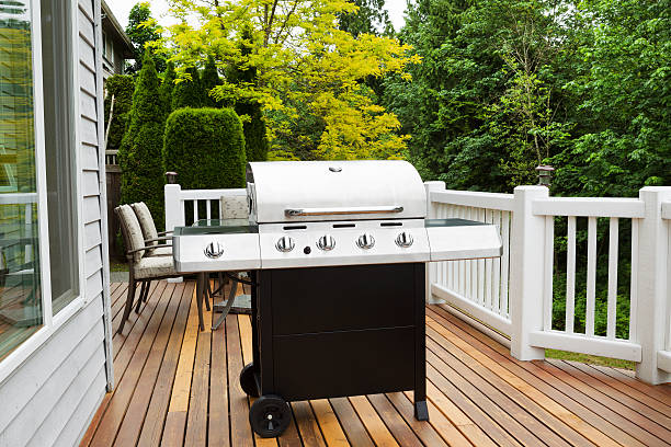 istock Large BBQ Grill on Wooden Deck 497021617