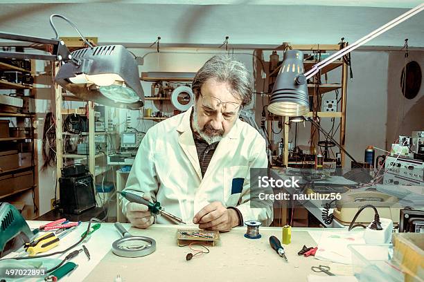 Electronic Engineer In The Laboratory With A Soldering Iron Stock Photo - Download Image Now