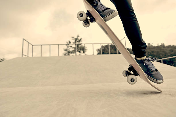 istock skateboarder jump at skatepark 497022919
