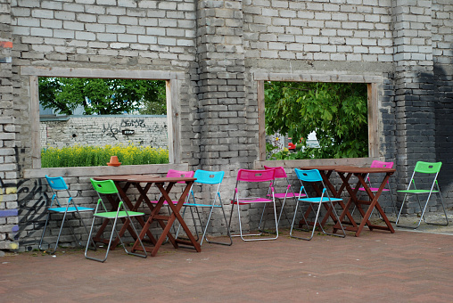 Bright, colorful chairs and tables set up outdoors in Tallinn, Estonia