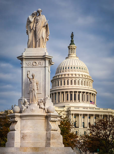 istock Peace statue and United States Capitol close up 497023934