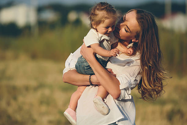 istock mother and daughter on a rural road 497024052