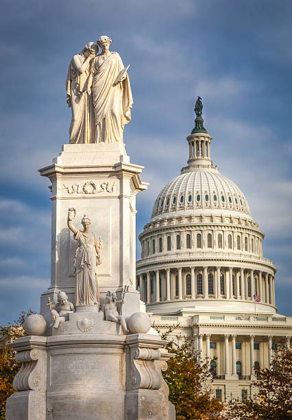 istock Peace statue and United States Capitol close up 497024156