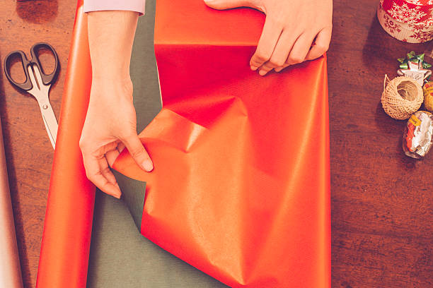 istock Woman Wrapping Christmas Present 497024664