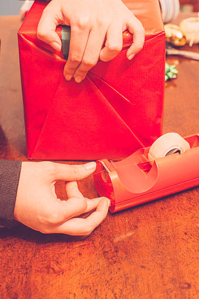 istock Woman Wrapping Christmas Present 497025646
