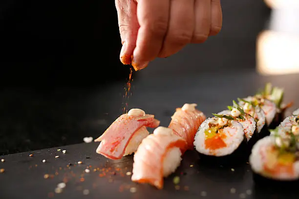 Photo of Smoked salmon nigiri sushi.