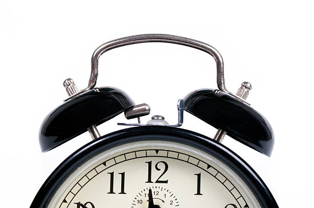 istock Classic old black alarm clock on white background 497027884